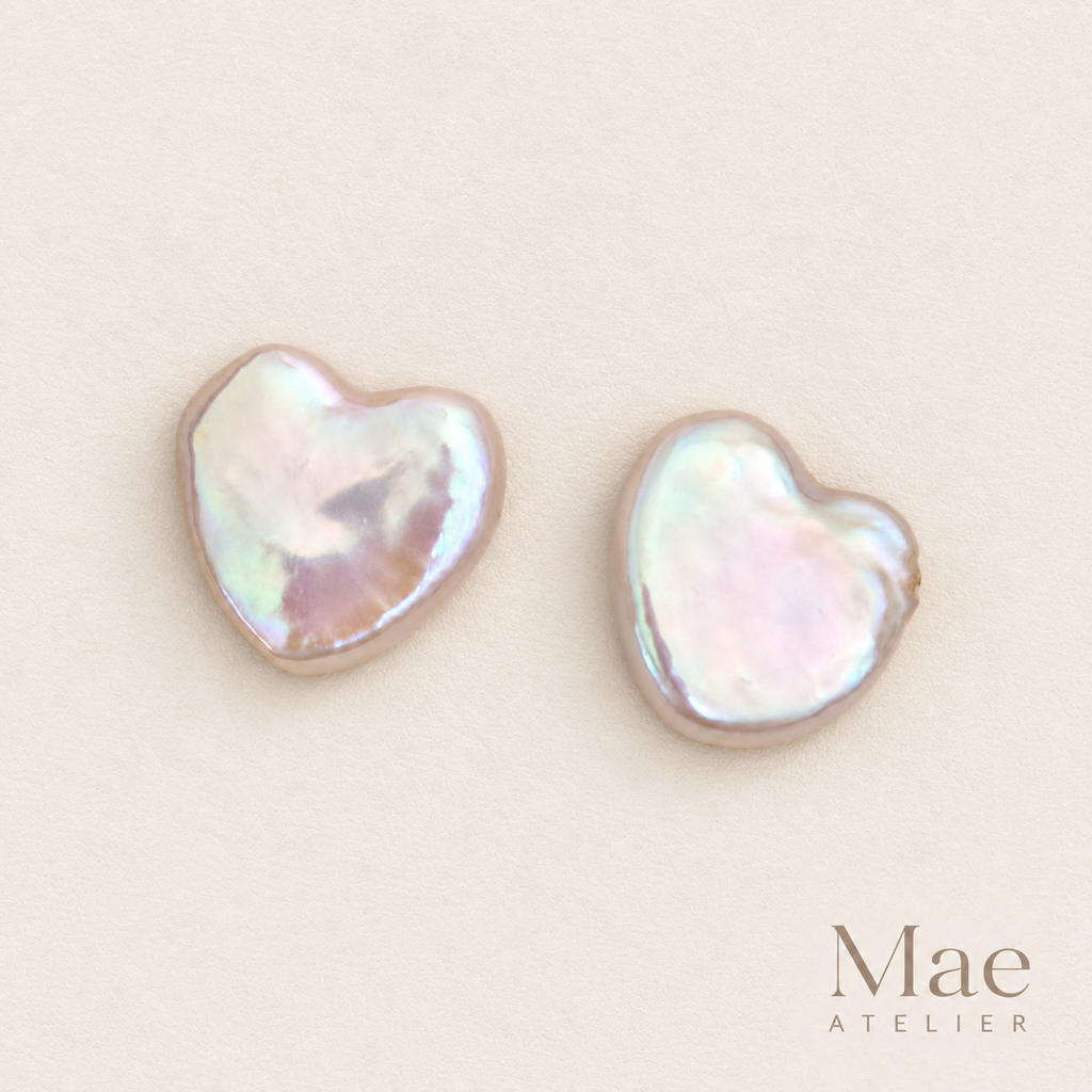 Matched pair of heart pearl stud earrings