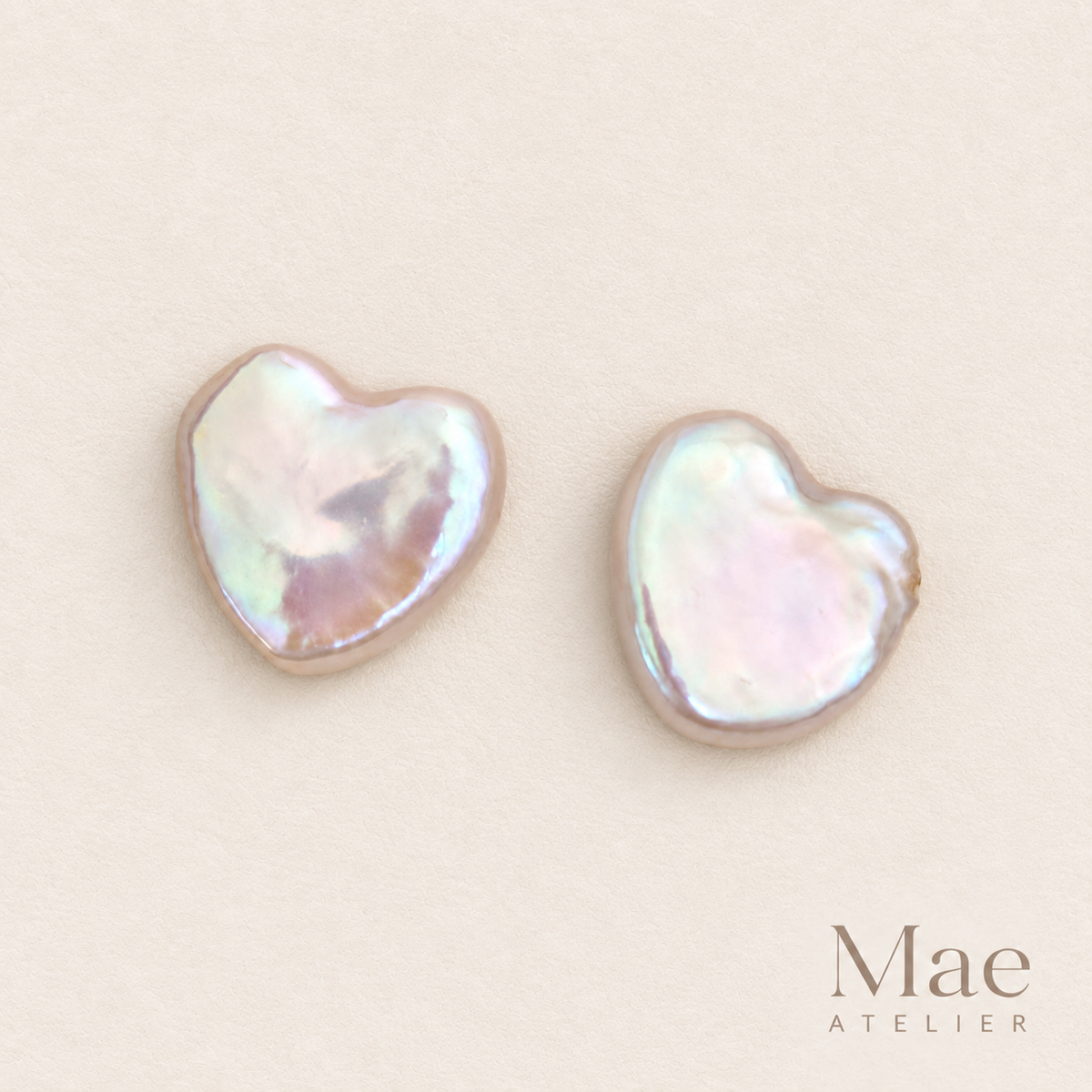 Matched pair of heart pearl stud earrings