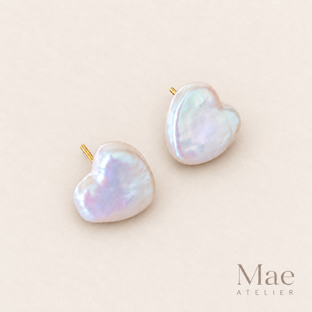 Model wearing heart pearl stud earrings