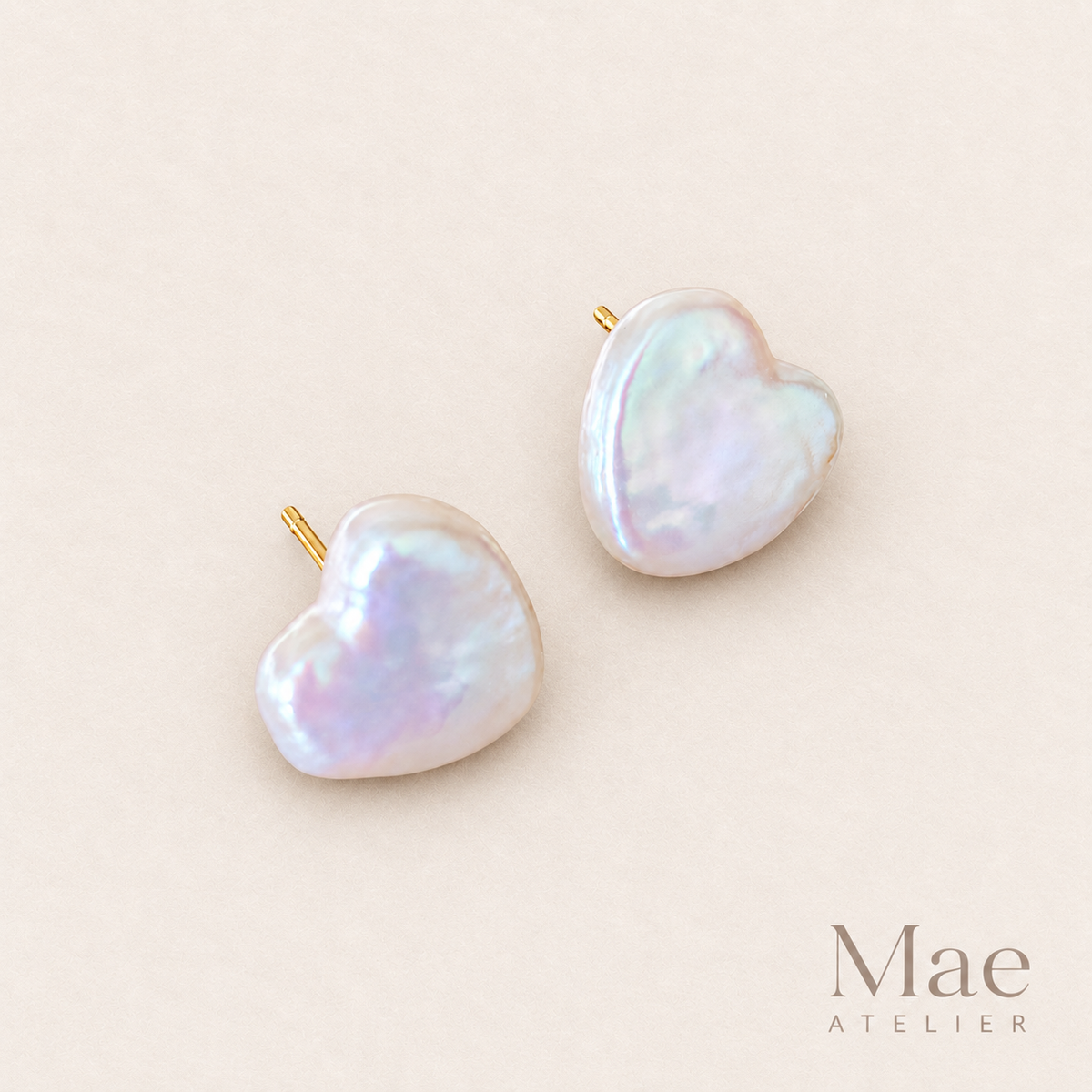 Model wearing heart pearl stud earrings