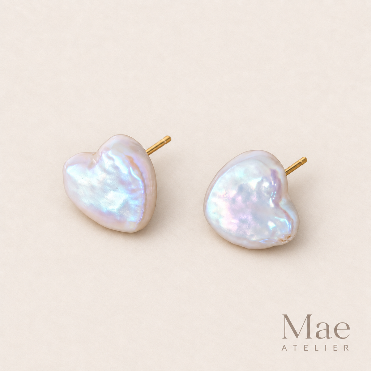 Heart-shaped freshwater baroque pearl stud earrings on sterling silver posts