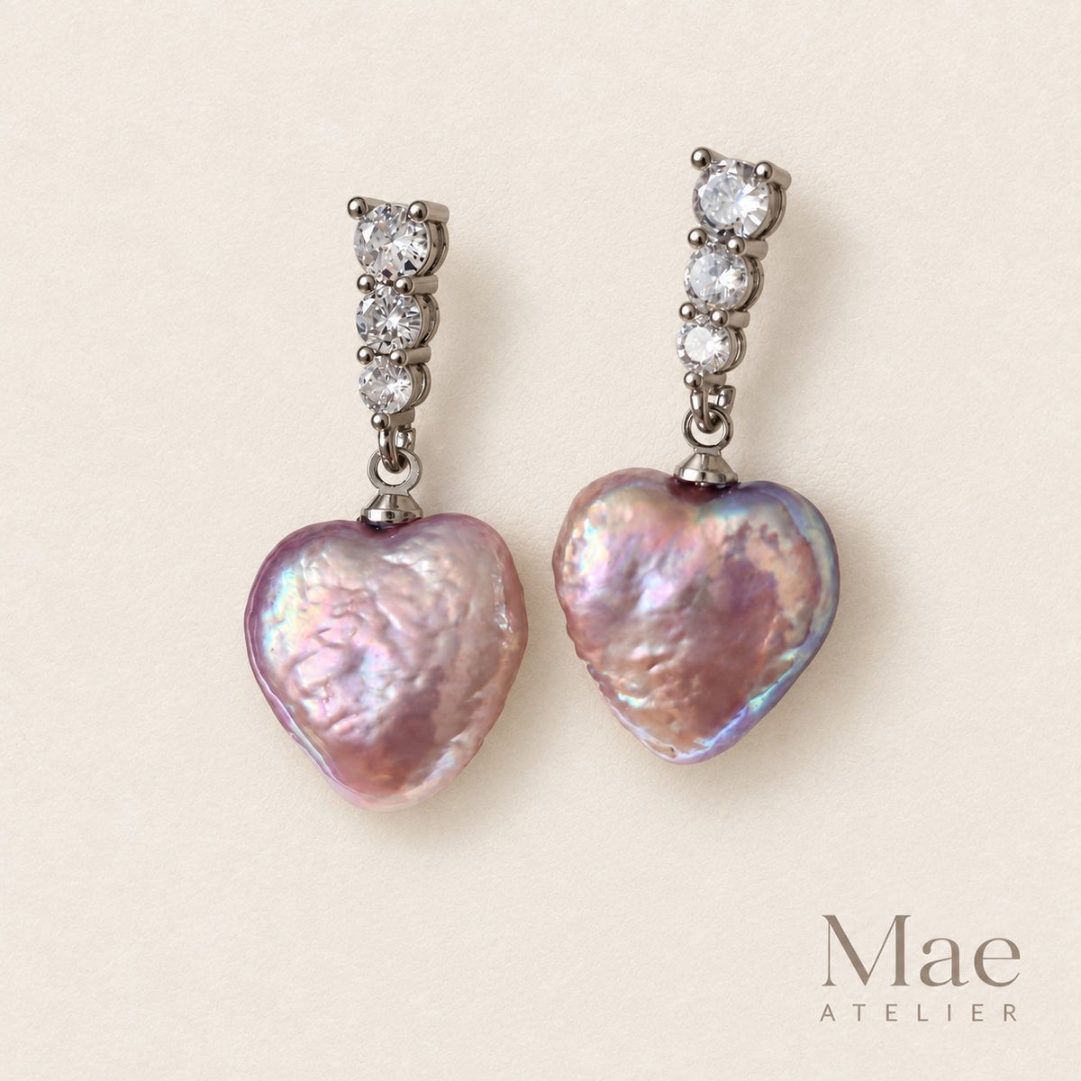 Purple heart freshwater pearl drop earrings with cubic zirconia tops