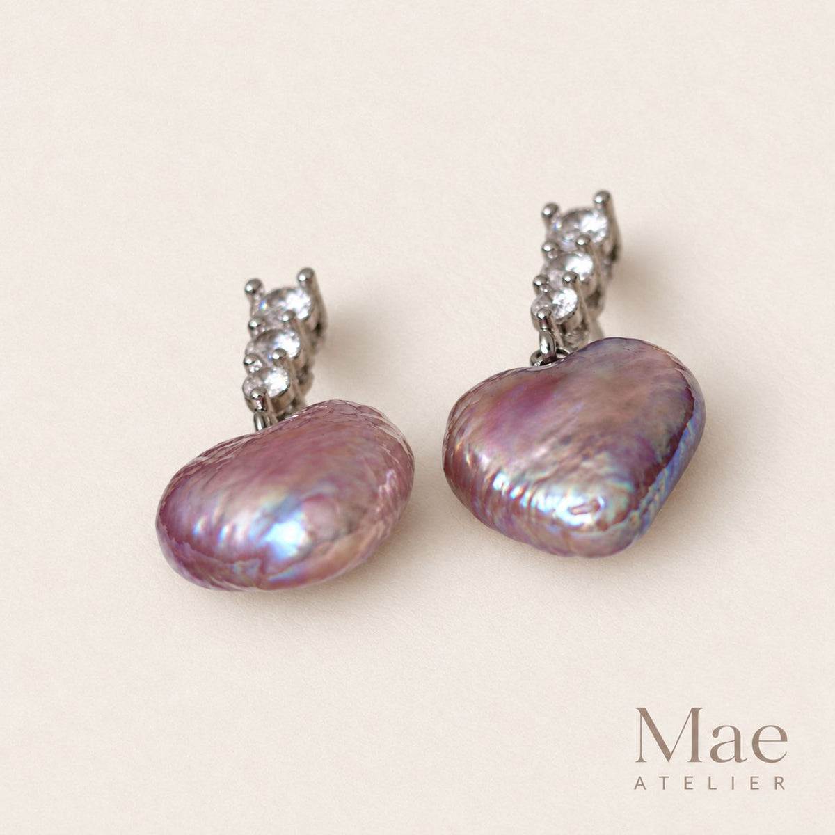 Close-up of natural purple baroque heart pearls with cubic zirconia
